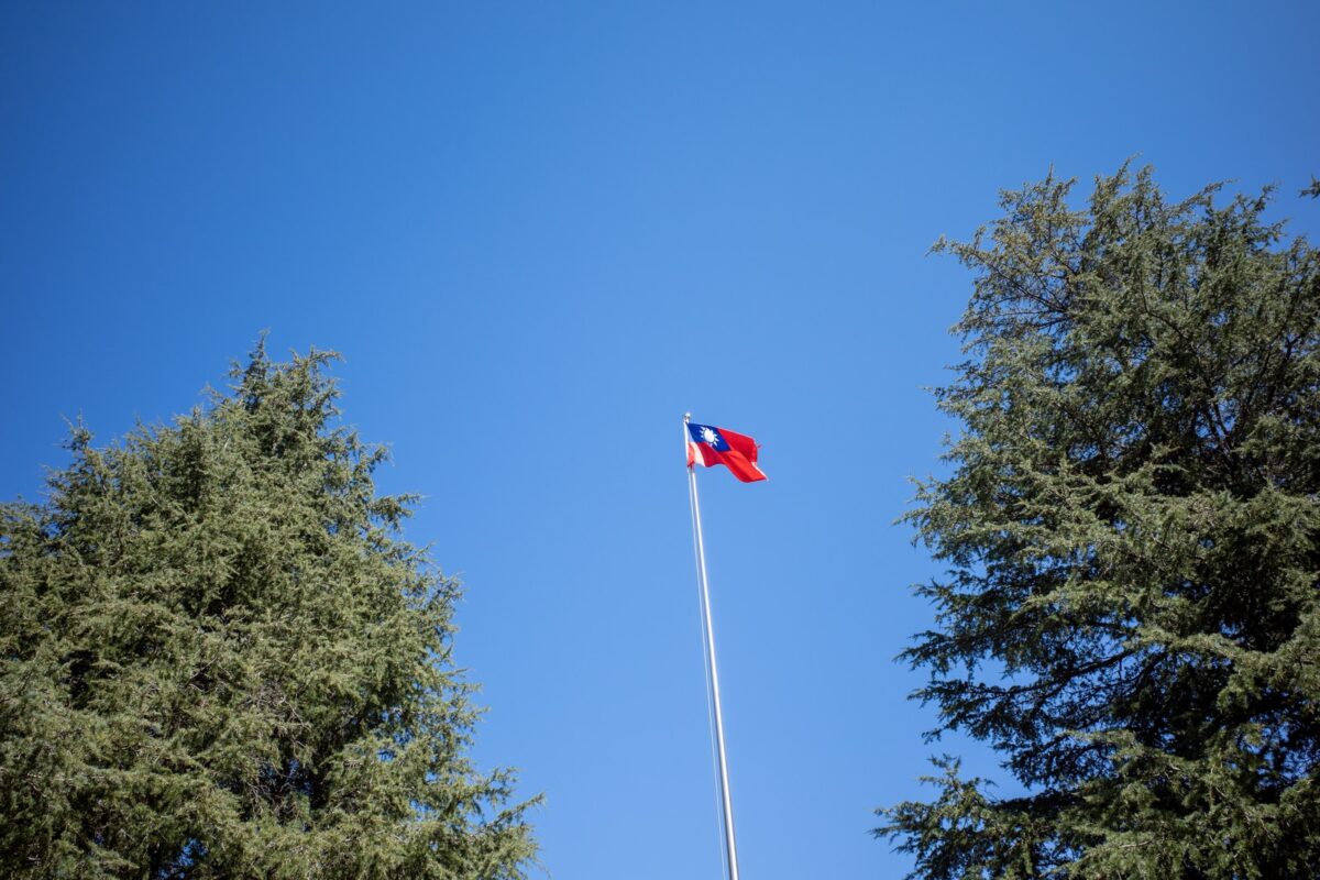red white and blue flag on pole