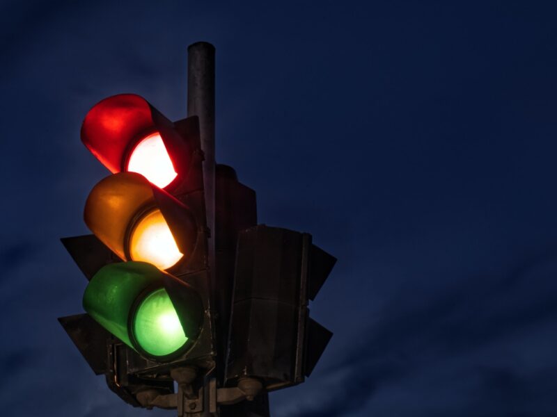 black traffic light turned on during night time