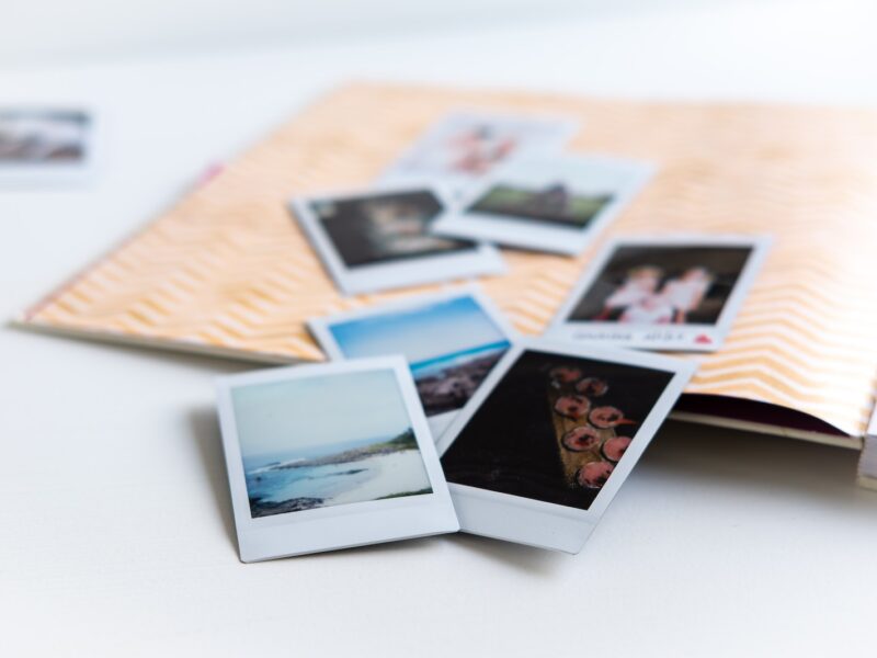 photos on white wooden table