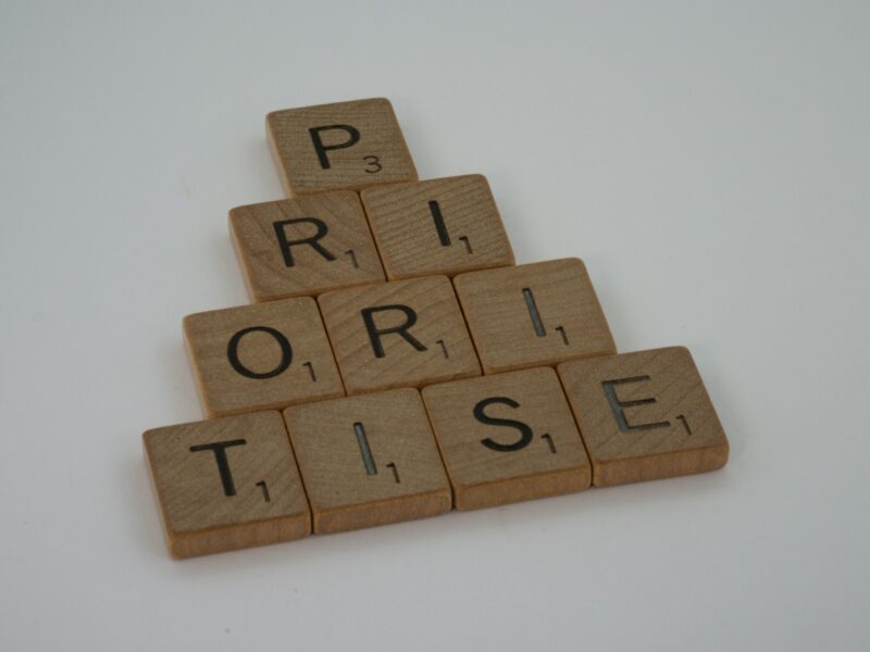 a scrabbled wooden block spelling the word prize